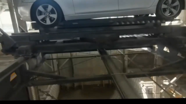 iven up and down by an electric motor to park the vehicle vertically in different layers inside the garage.
Vertical Lifting Parking System usually consist of one or more three-dimensional parking levels, each with multiple parking Spaces. The owner can hand over the vehicle to a mechanical system at the entrance via a control system, and the vehicle is then raised and lowered vertically to a designated parking space.