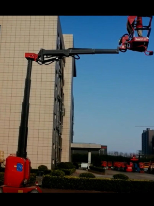 Self-propelled electric scissor boom lift aerial work platform